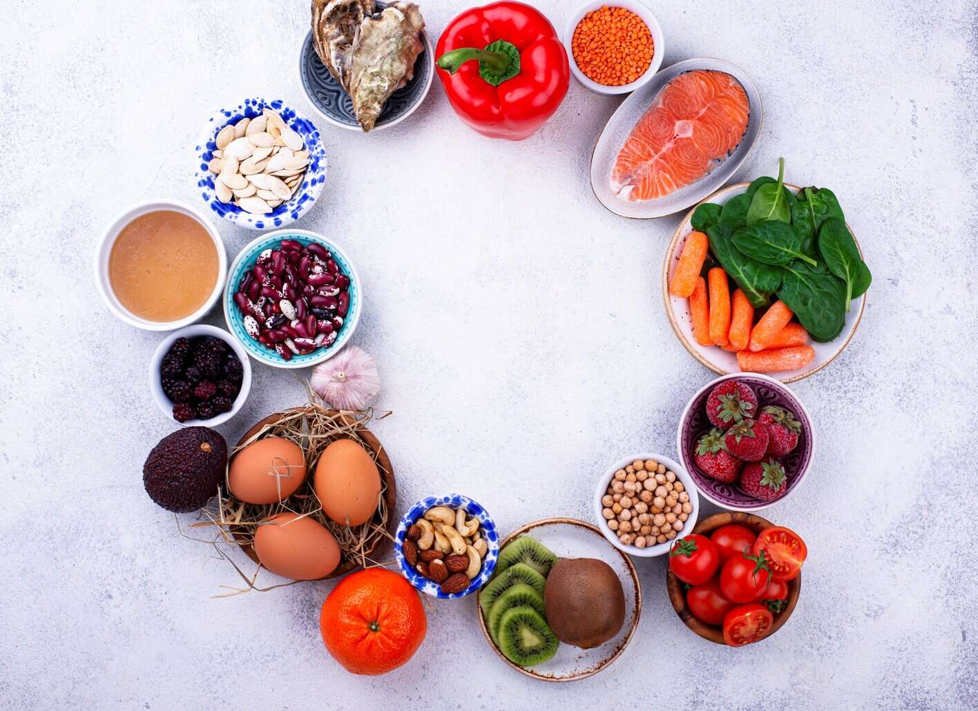 Vibrant mix of whole fruits and vegetables representing ingredients featured in NutriFusion blends.