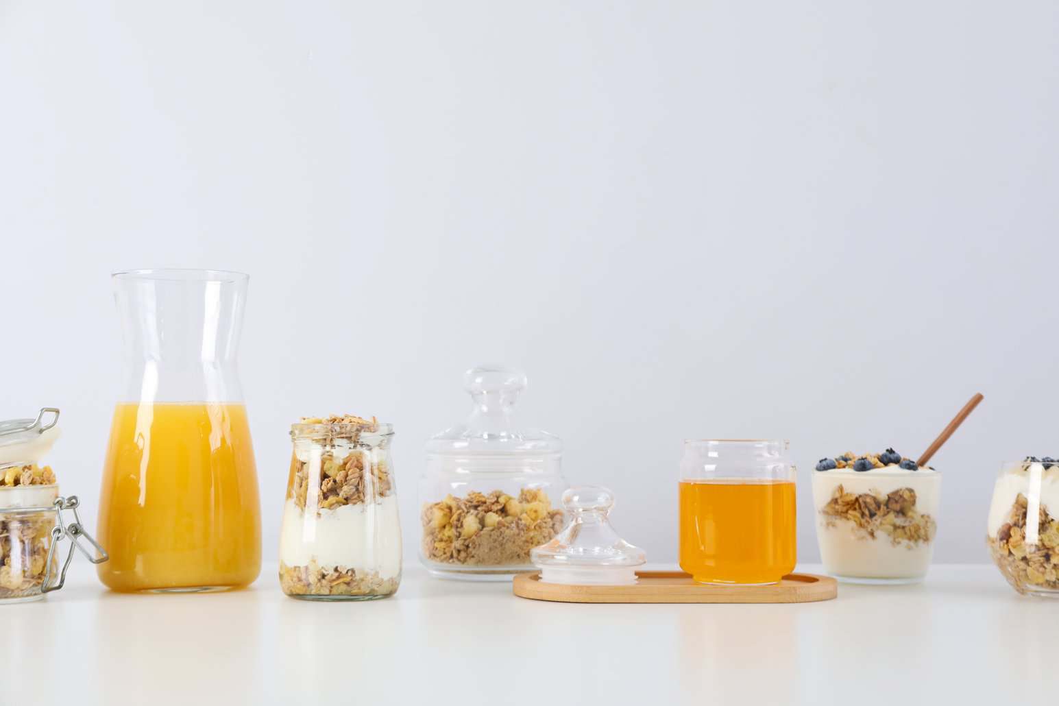 Breakfast setup with granola, yogurt, and orange juice prepared with NutriFusion blend.